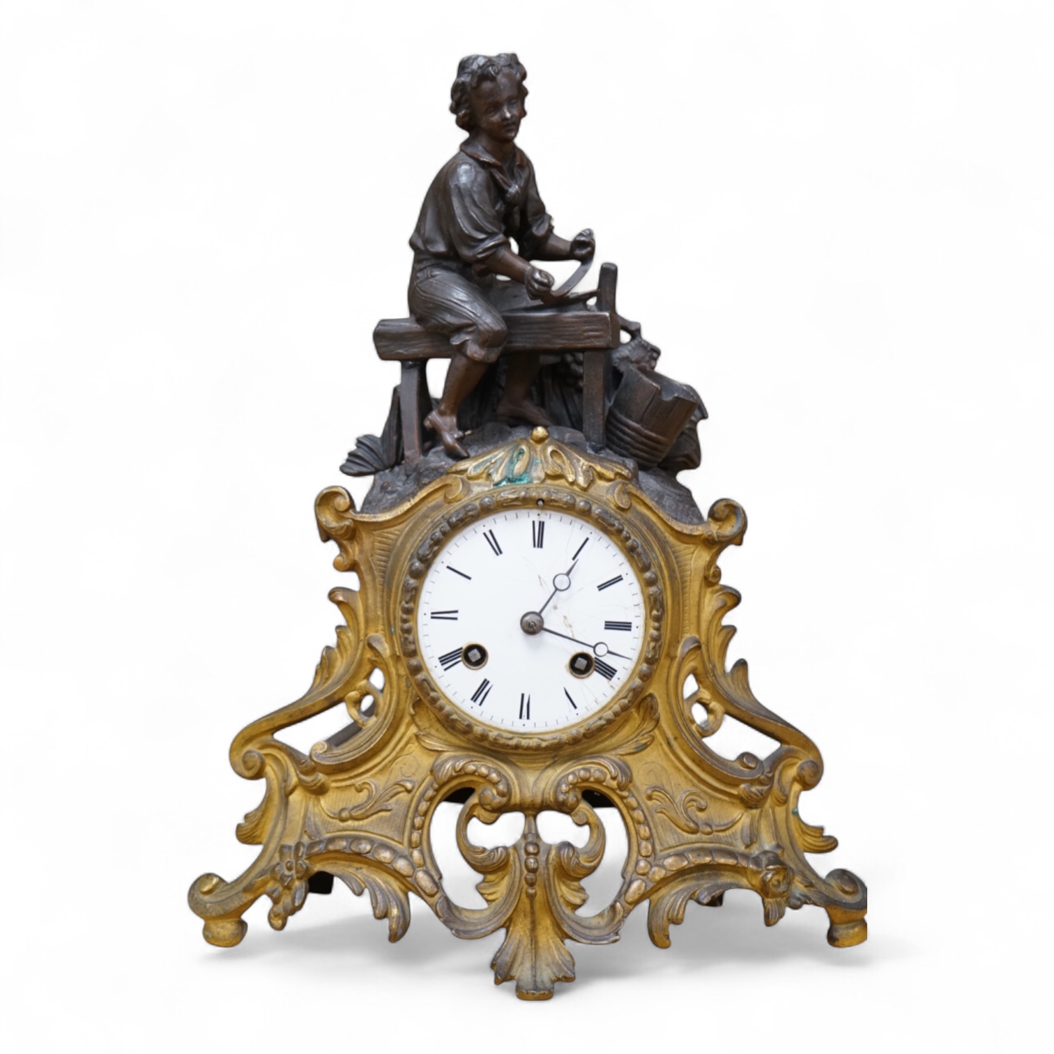 A French gilt and patinated spelter mantel clock, with artisan worker mount. 32cm high